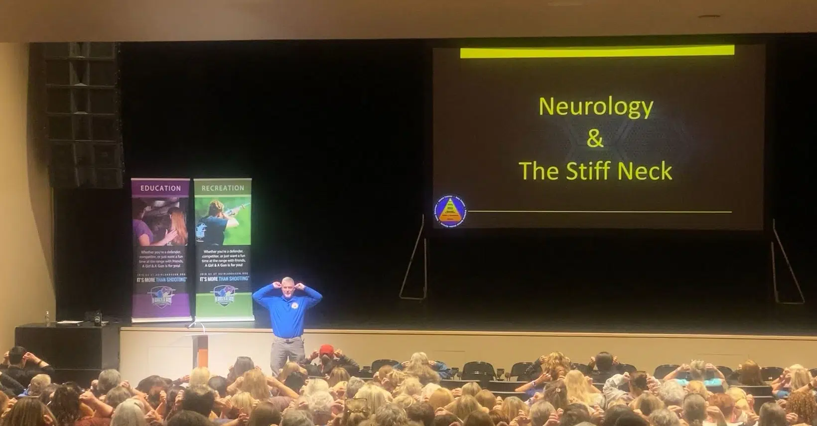 Ox speaking to a crowd of 320+ at the AG&AG National Conference on Neurology & The Stiff Neck